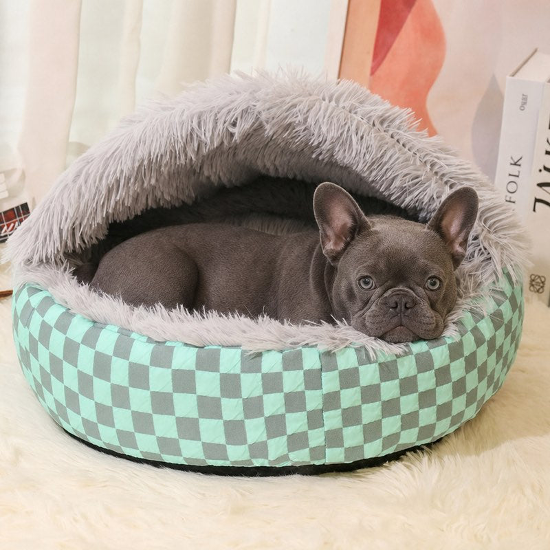 Blue French Bulldog lying in the gray Hooded Frenchie Donut Bed