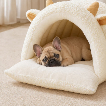 White Lamb Frenchie Cave Bed with the front flap folded out as a cushion and a fawn French bulldog resting on it