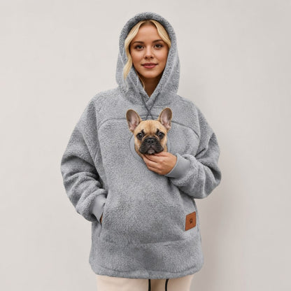 Woman in a gray Sherpa French Bulldog Carrier Hoodie with a fawn French bulldog in the front pouch