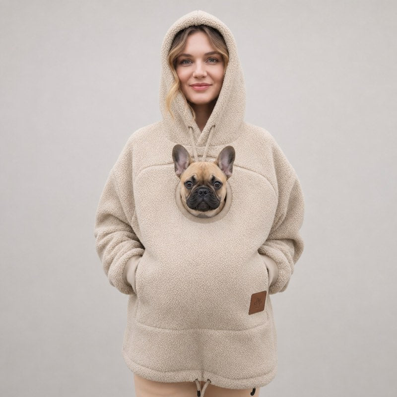 Beige Sherpa French Bulldog Carrier Hoodie on a model with a Frenchie peeking out of the pouch