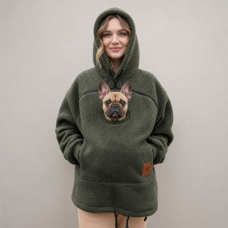Green Sherpa French Bulldog Carrier Hoodie on a model with a Frenchie peeking out of the pouch