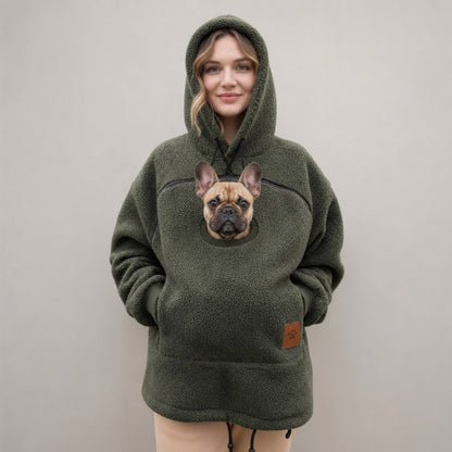 Green Sherpa French Bulldog Carrier Hoodie on a model with a Frenchie peeking out of the pouch
