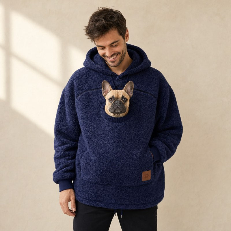 Man wearing the navy blue Sherpa French Bulldog Carrier Hoodie with a fawn Frenchie in the pouch